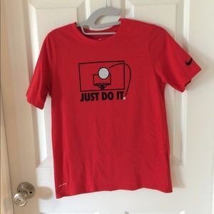 Never worn boys large Nike short-sleeve t-shirt.